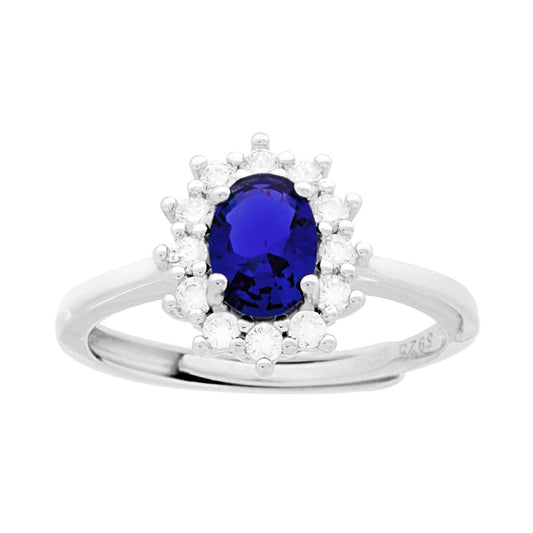 Ovaler Halo-Solitär-Ring mit blauem Zirkon-Saphir, umrundet von weißen Zirkonen, aus 925er Silber rhodiniert. - MeinSchmuckShop
